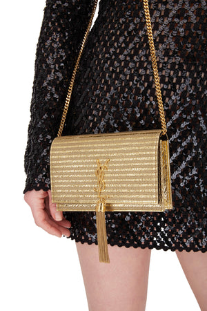 Woman Wearing Saint Laurent Monogramme Gold Striped Kate Bag