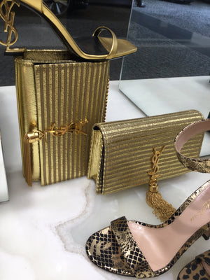 Saint Laurent Monogramme Gold Striped Kate Bag Lined up with Shoes